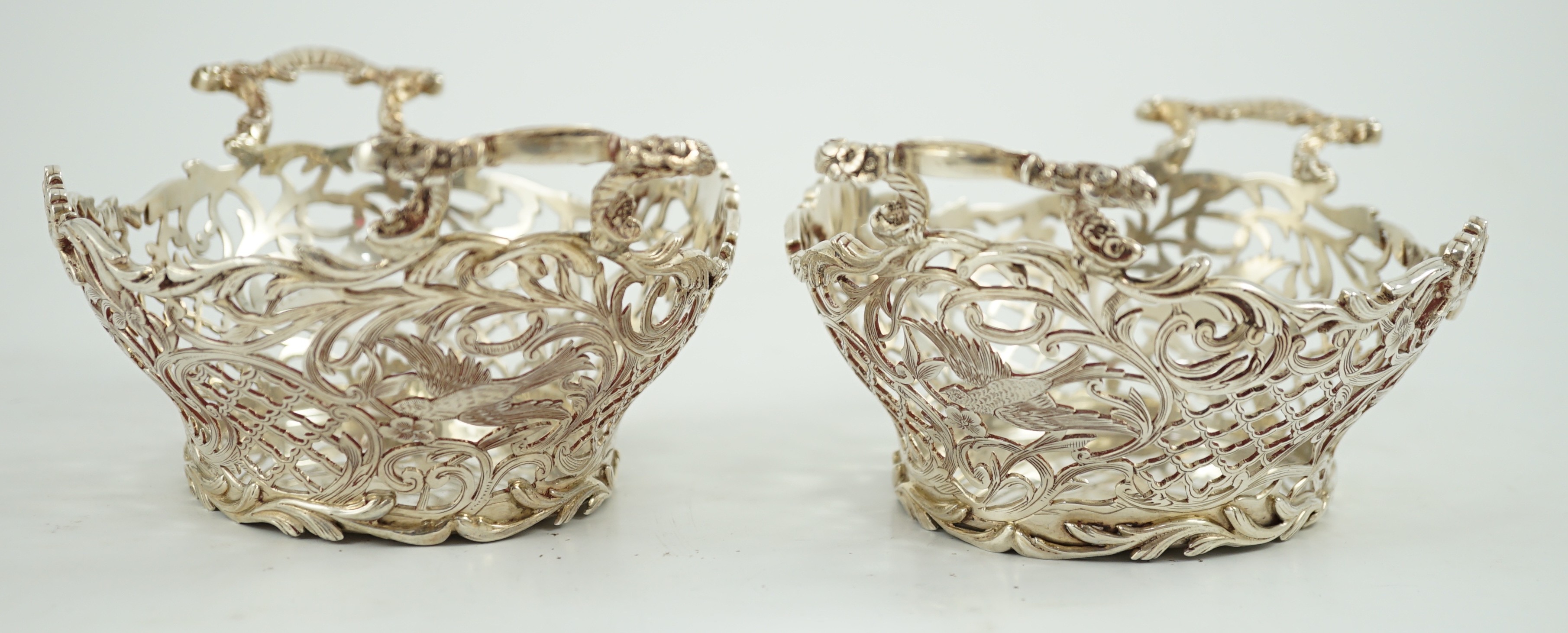 A pair of Edwardian pierced silver two handled bon bon dishes, by William Comyns